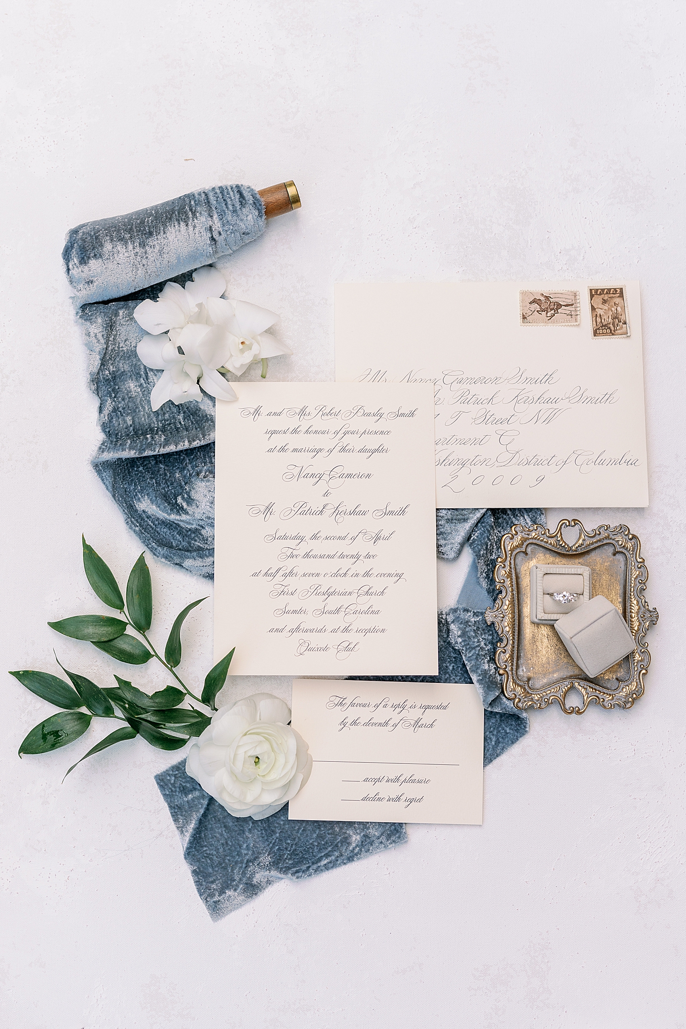 Invitation suite styled with ring boxes and ribbon | Photo by Annie Laura Photography
