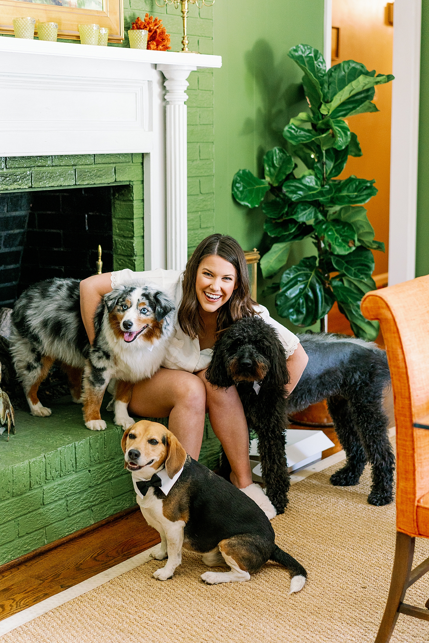 Bride snuggling with her dogs before her wedding | Photo by Annie Laura Photography