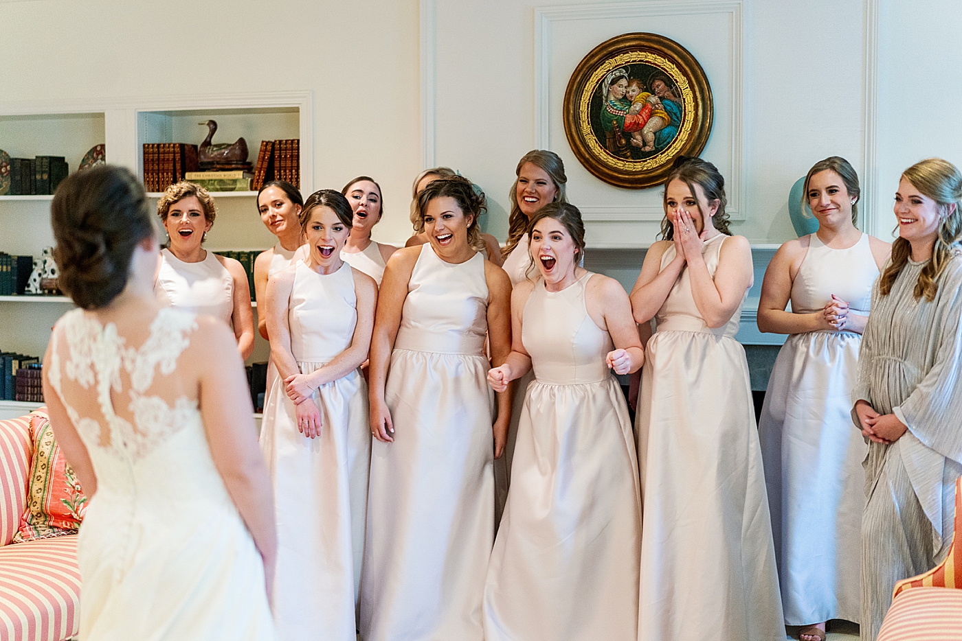 Bridesmaids react to seeing bride for the first time | Photo by Annie Laura Photography