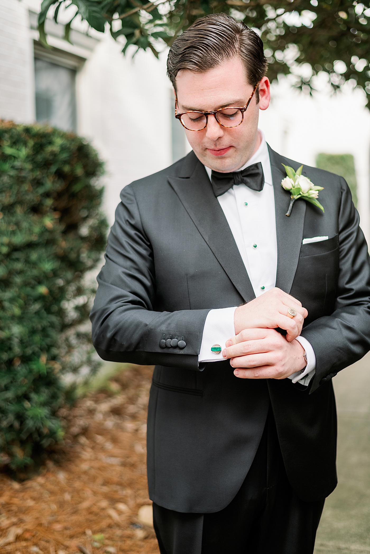 Groom adjusting his cuff links | Photo by Annie Laura Photography