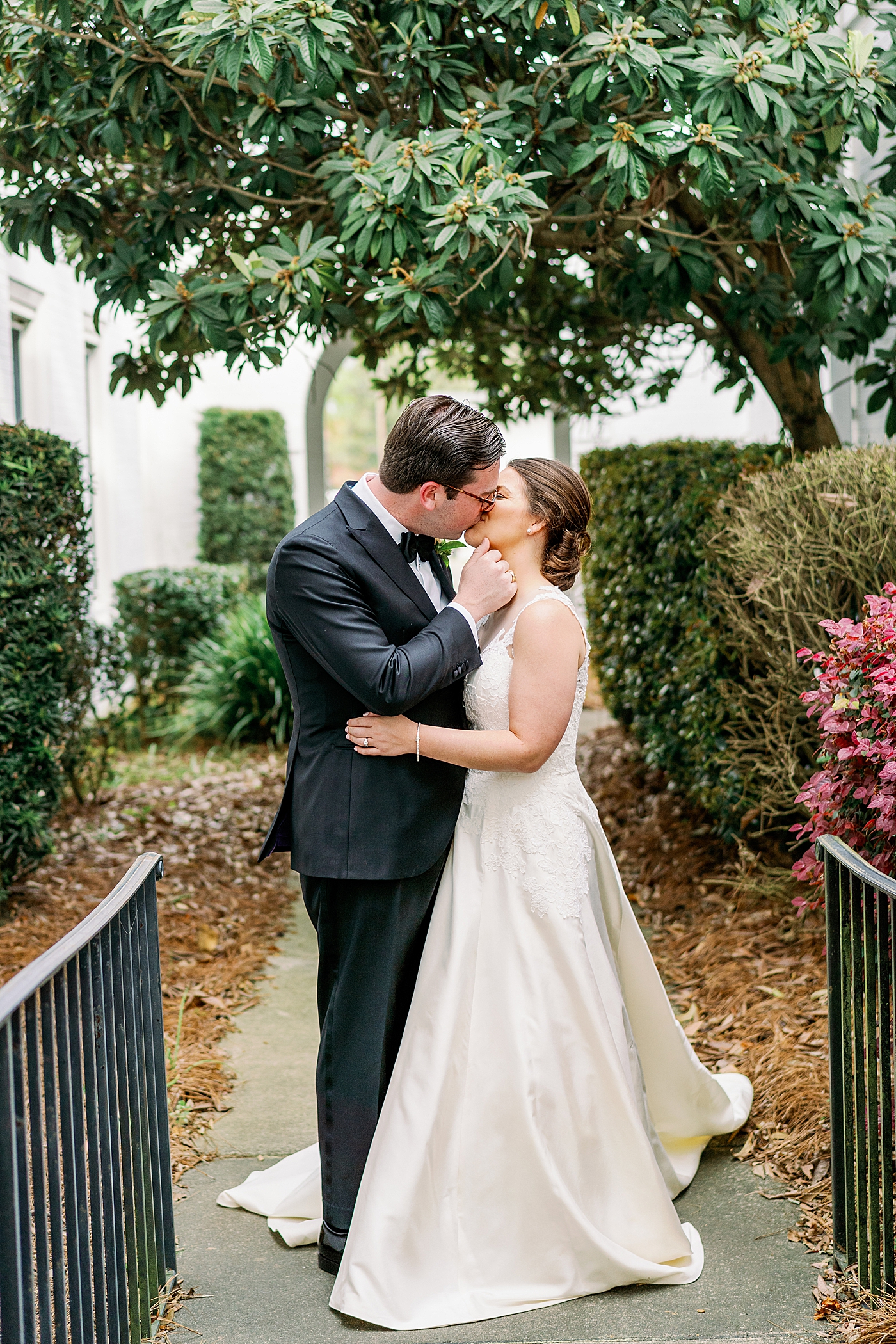 Bride and groom kissing after their first look | Photo by Annie Laura Photography