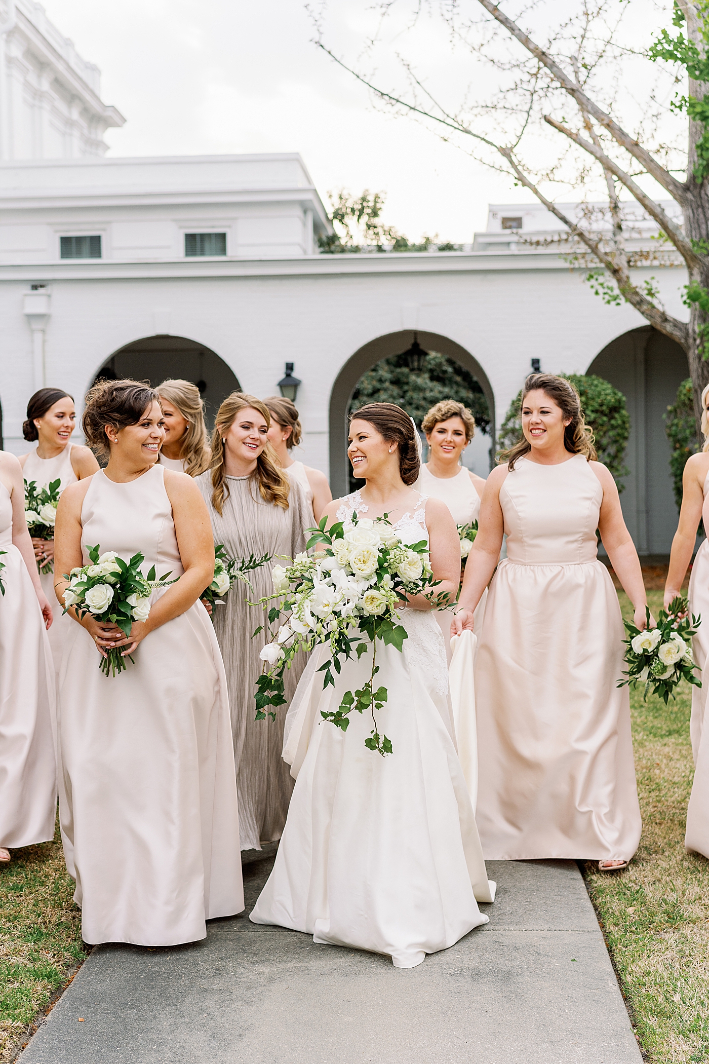 Bridal party walking together during Timeless Country Club Wedding | Photo by Annie Laura Photography