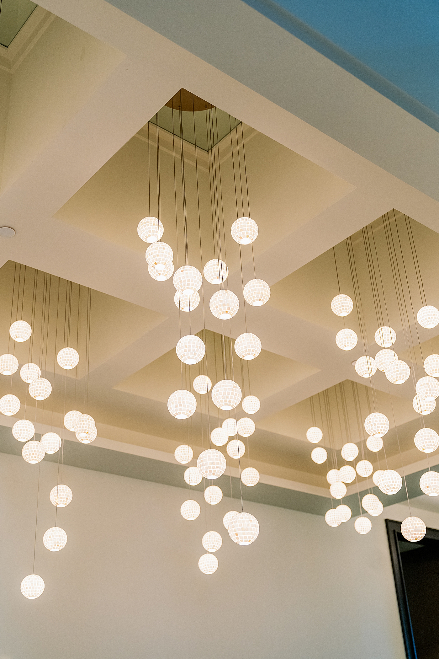 Circular lights at a wedding reception | Photo by Annie Laura Photography