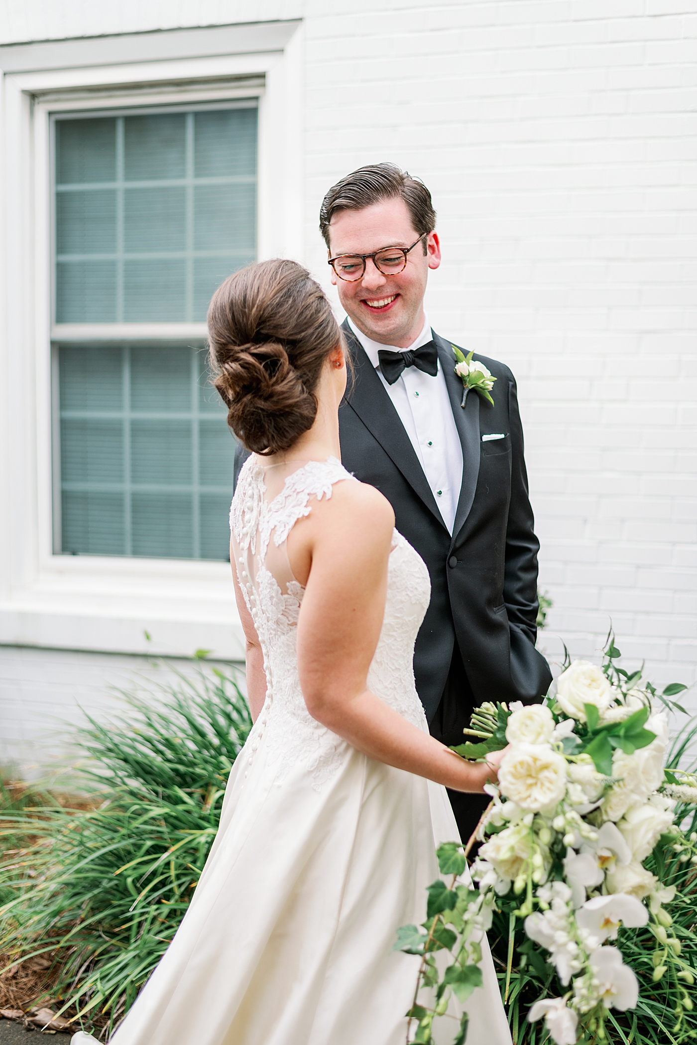 Groom smiling at his bride during their couple portraits | Photo by Annie Laura Photography