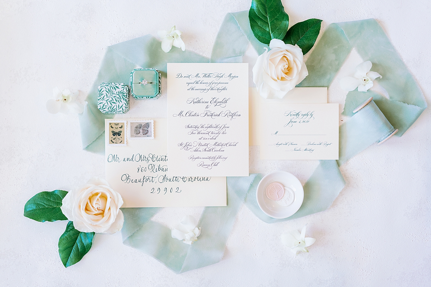 Bridal invitation styled with florals and blue ribbon | Image by Annie Laura Photo