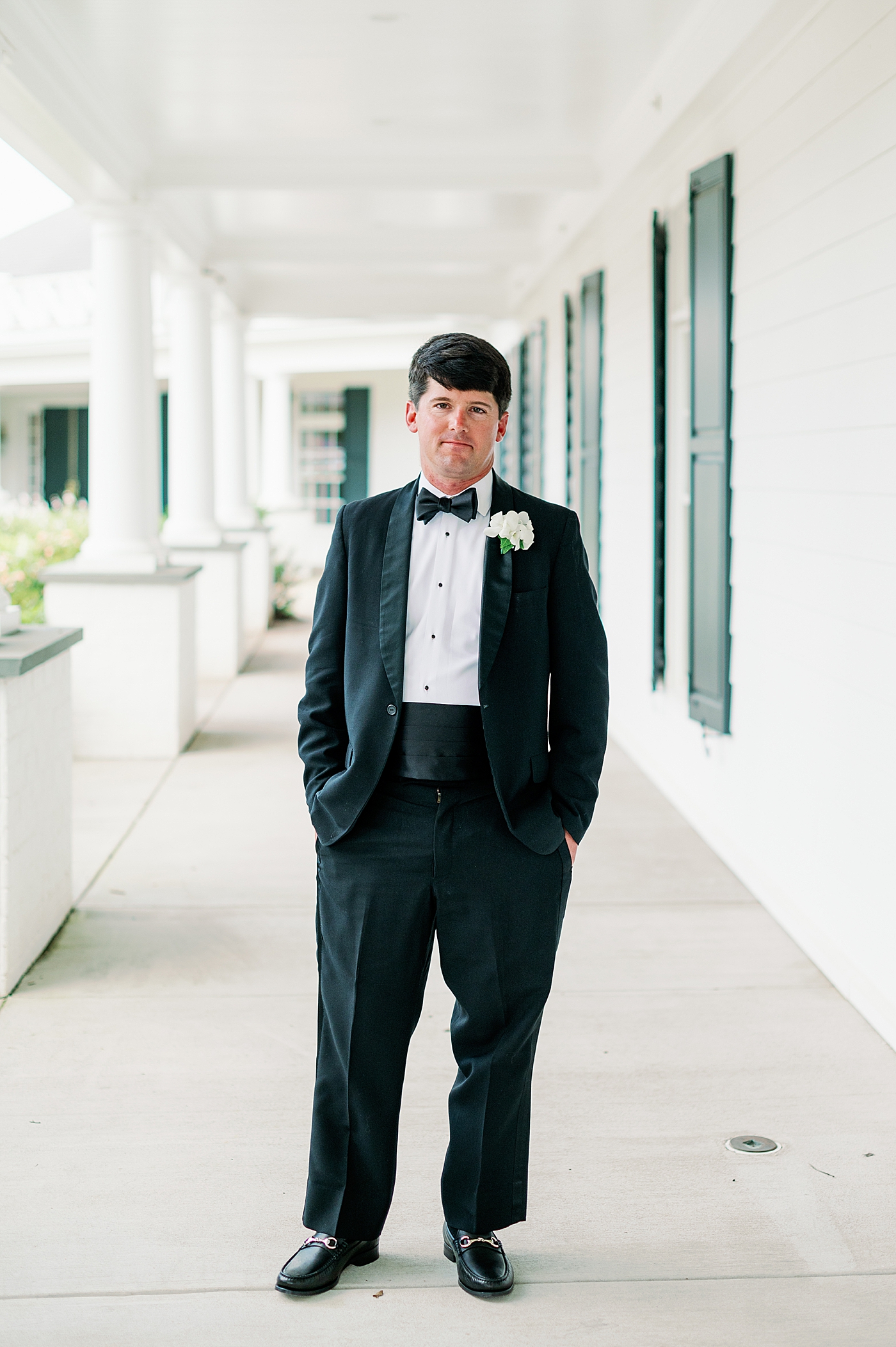 Groom in a tux posing for the camera | Image by Annie Laura Photo