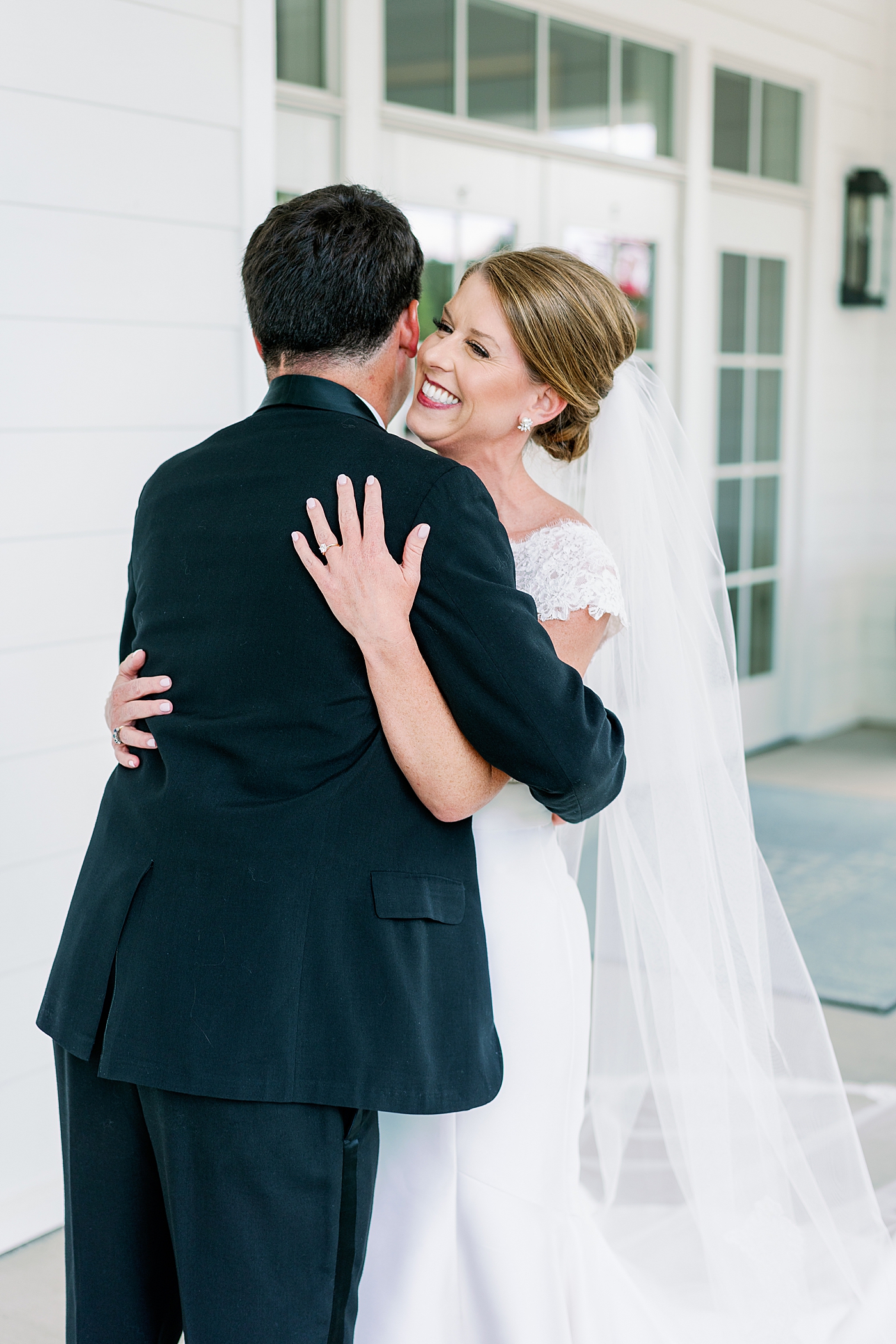 Bride and groom hugging after their first look | Image by Annie Laura Photo
