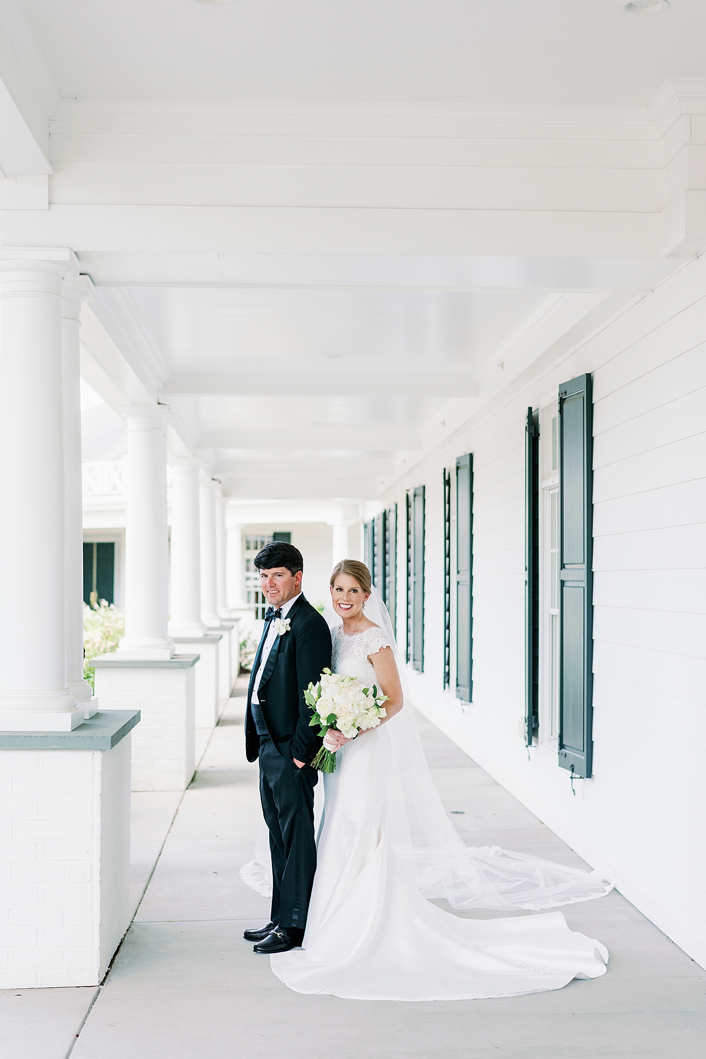 Bride and groom portraits on the porch | Image by Annie Laura Photo