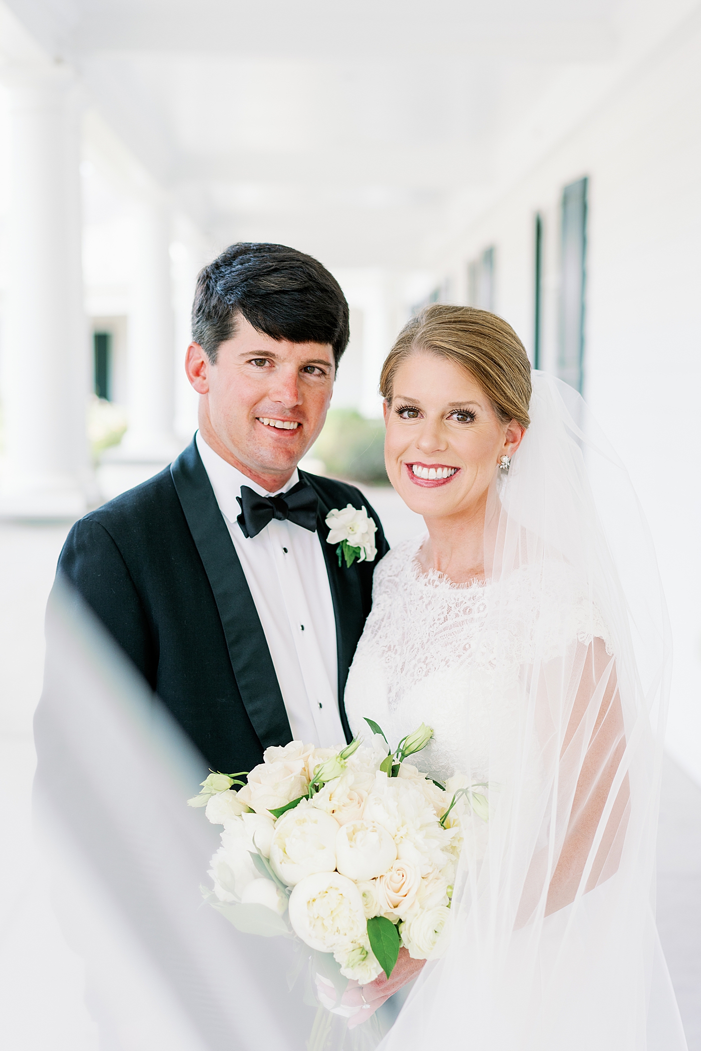Bride and groom smiling together after their first look | Image by Annie Laura Photo