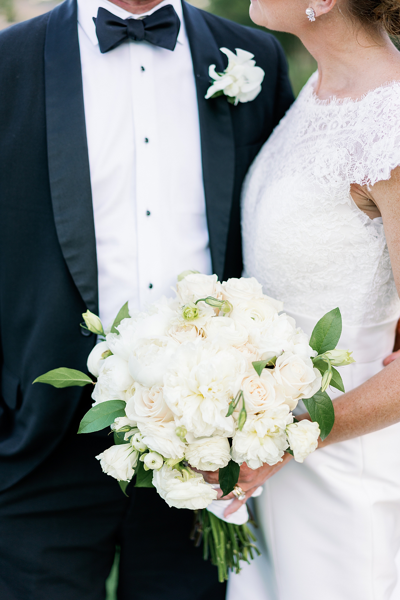 Bride holding bouquet of white flowers | Image by Annie Laura Photo