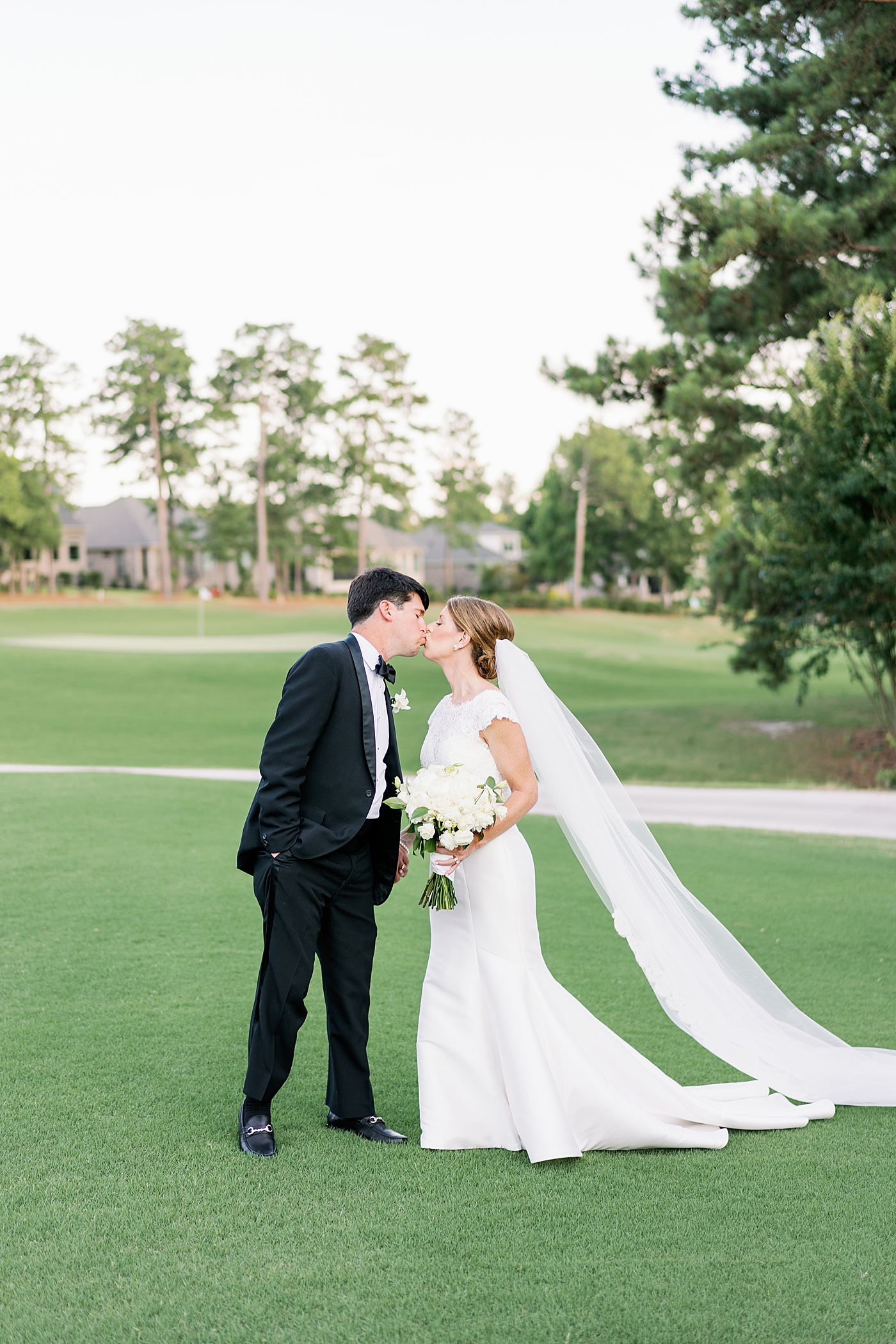 Bride and groom at their sunset portraits at their Simple Southern Country Club Wedding | Image by Annie Laura Photo