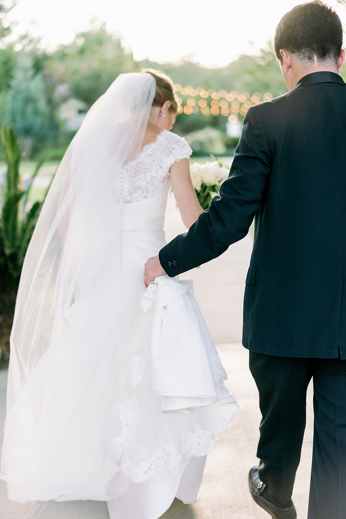 Bride and groom walking to their reception | Image by Annie Laura Photo