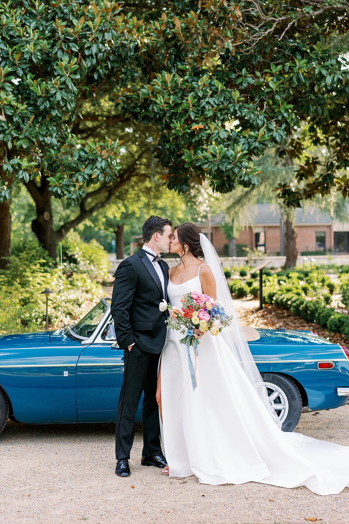 Bride and groom kissing before their wedding at Boyd Foundation Horticultural Center | Photo by Annie Laura Photo