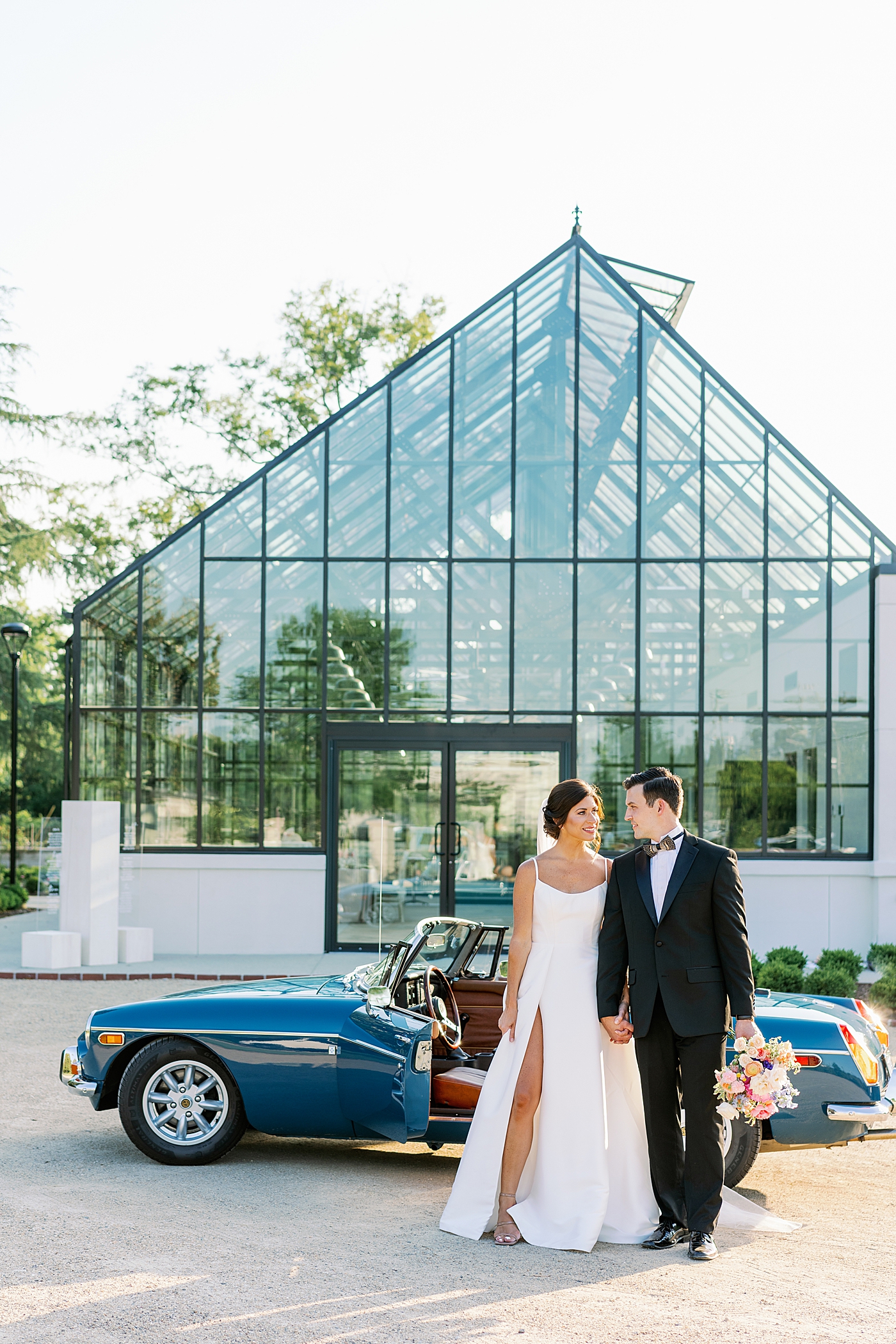 Bride and groom in front of Boyd Foundation Horticultural Center | Photo by Annie Laura Photo