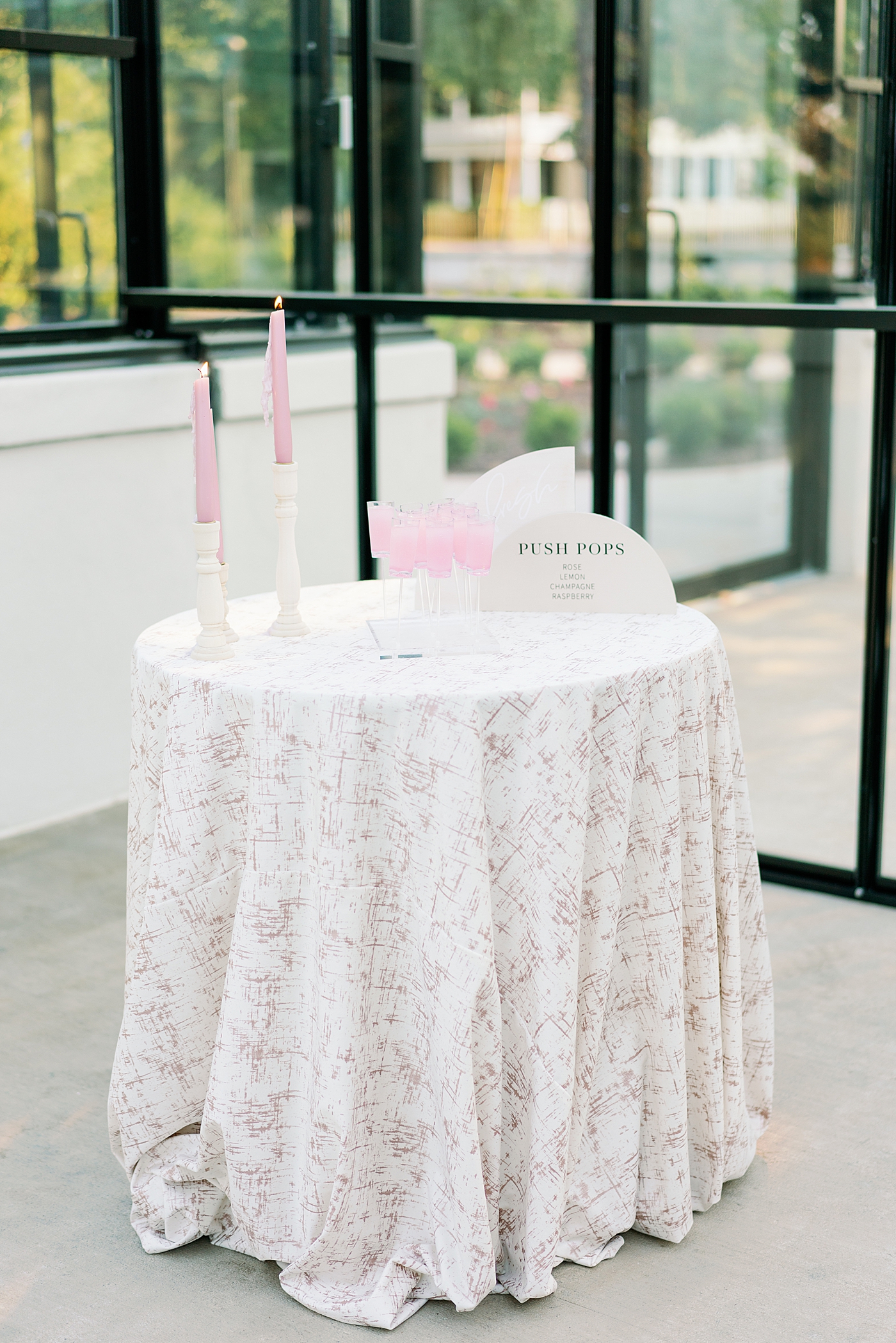 Custom push pops on a table during summer inspired garden wedding | Photo by Annie Laura Photo