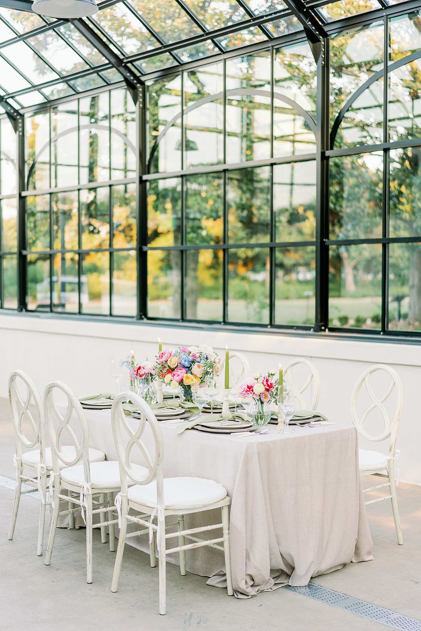 Styled table with bright florals during summer inspired garden wedding | Photo by Annie Laura Photo