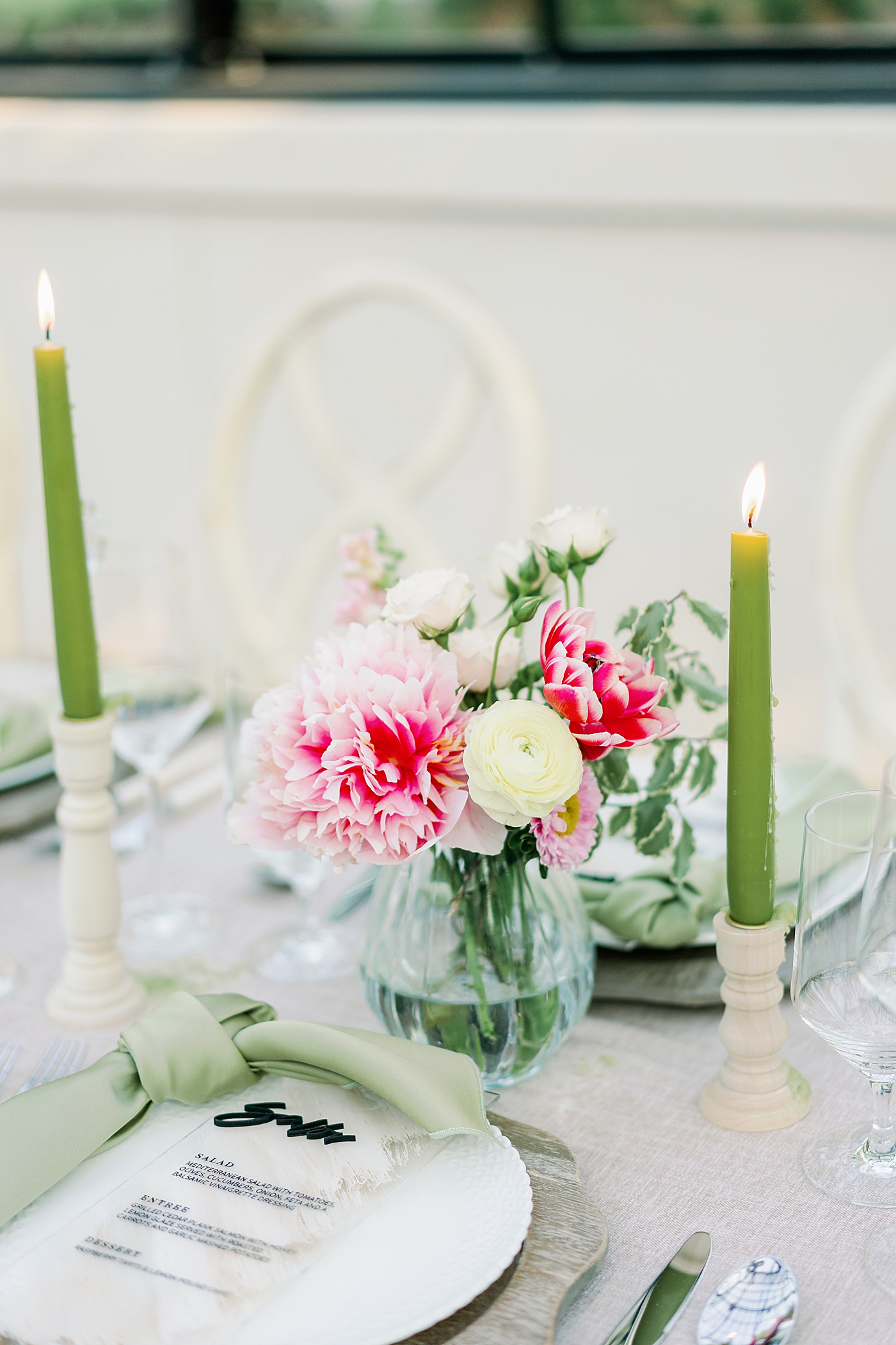 Colorful table setting with green pillar candles | Photo by Annie Laura Photo
