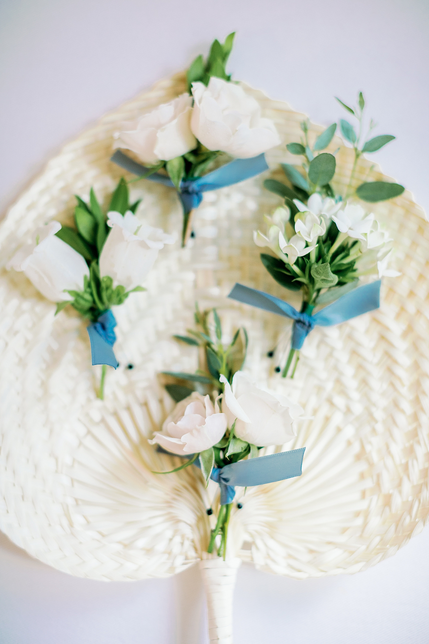 Wedding flowers on a sweetgrass fan | Images by Annie Laura Photography