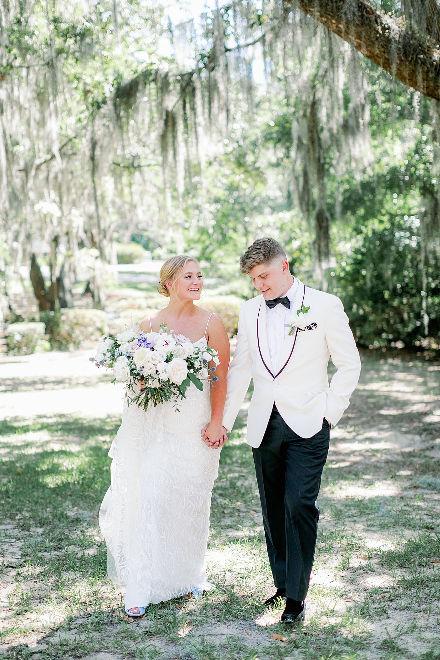 Bride and groom walking hand in hand | Images by Annie Laura Photography