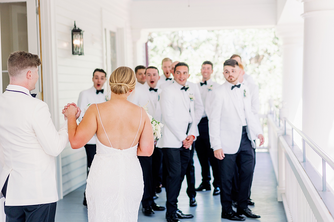 First look with groomsmen during Elegant Grandmillenial Charleston Wedding | Images by Annie Laura Photography