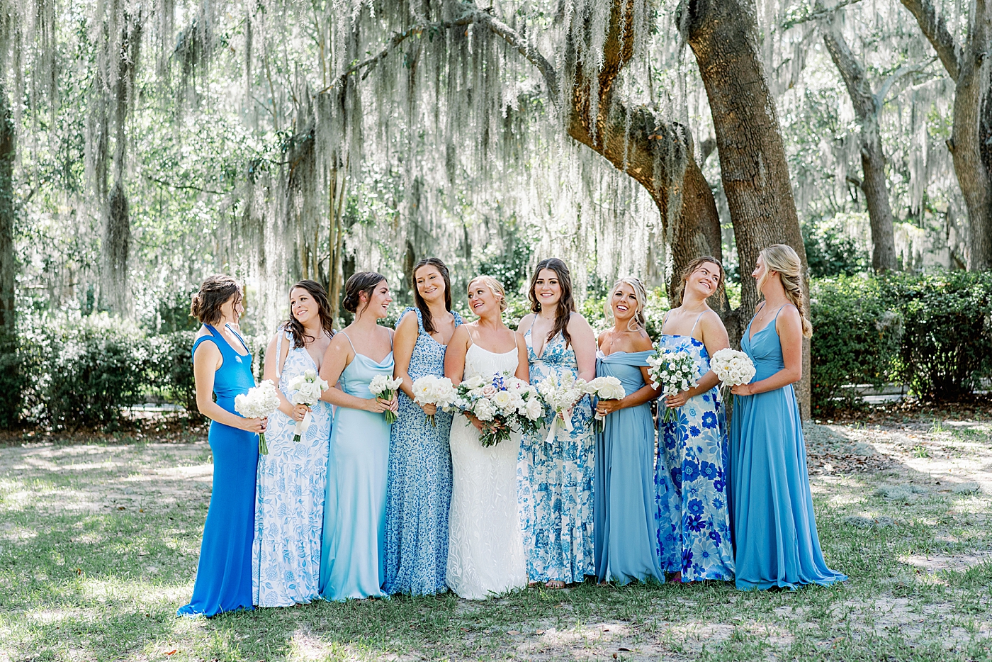Bride with her bridesmaids all in blue | Images by Annie Laura Photography