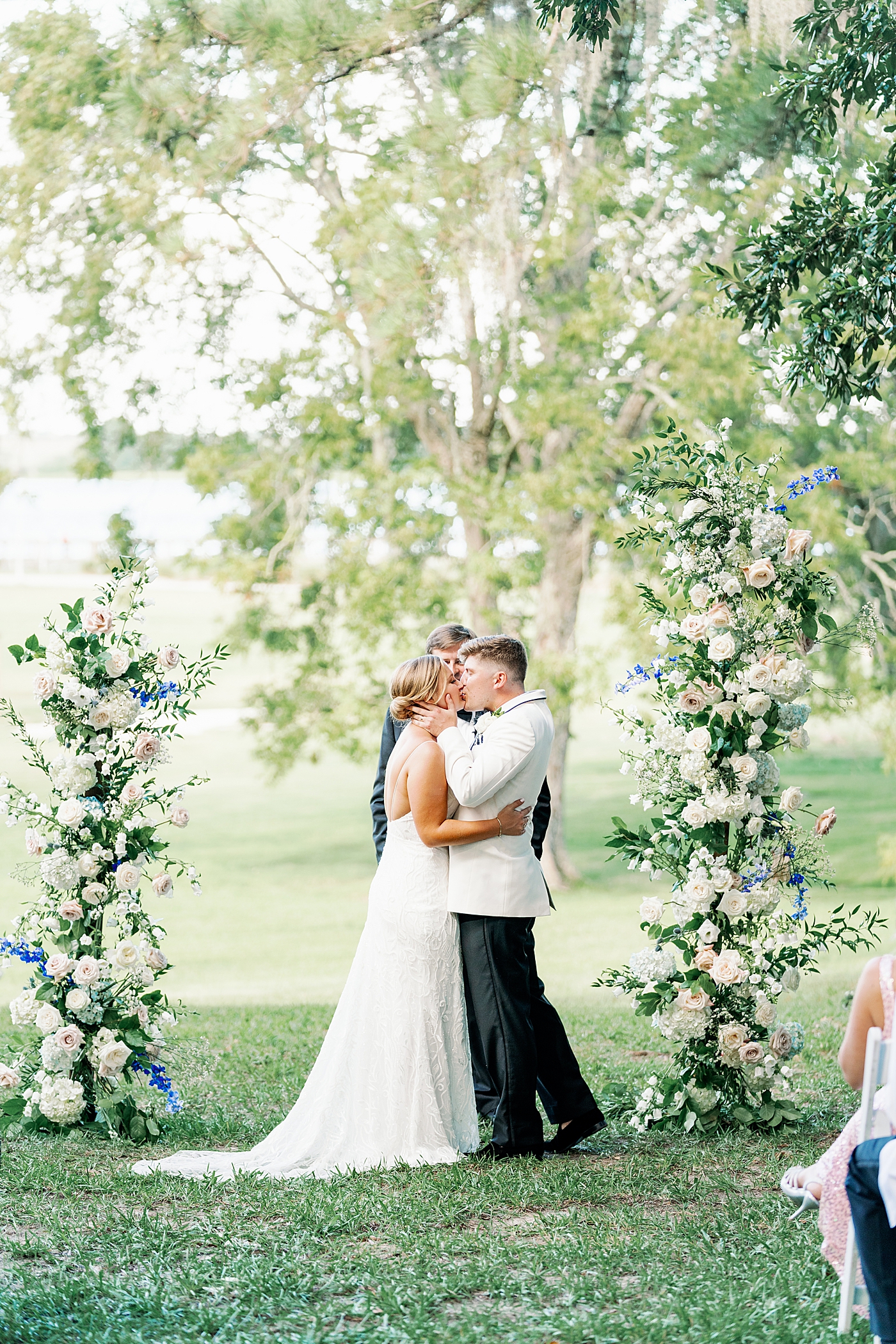 Bride and grooms first kiss during their Elegant Grandmillenial Charleston Wedding | Images by Annie Laura Photography