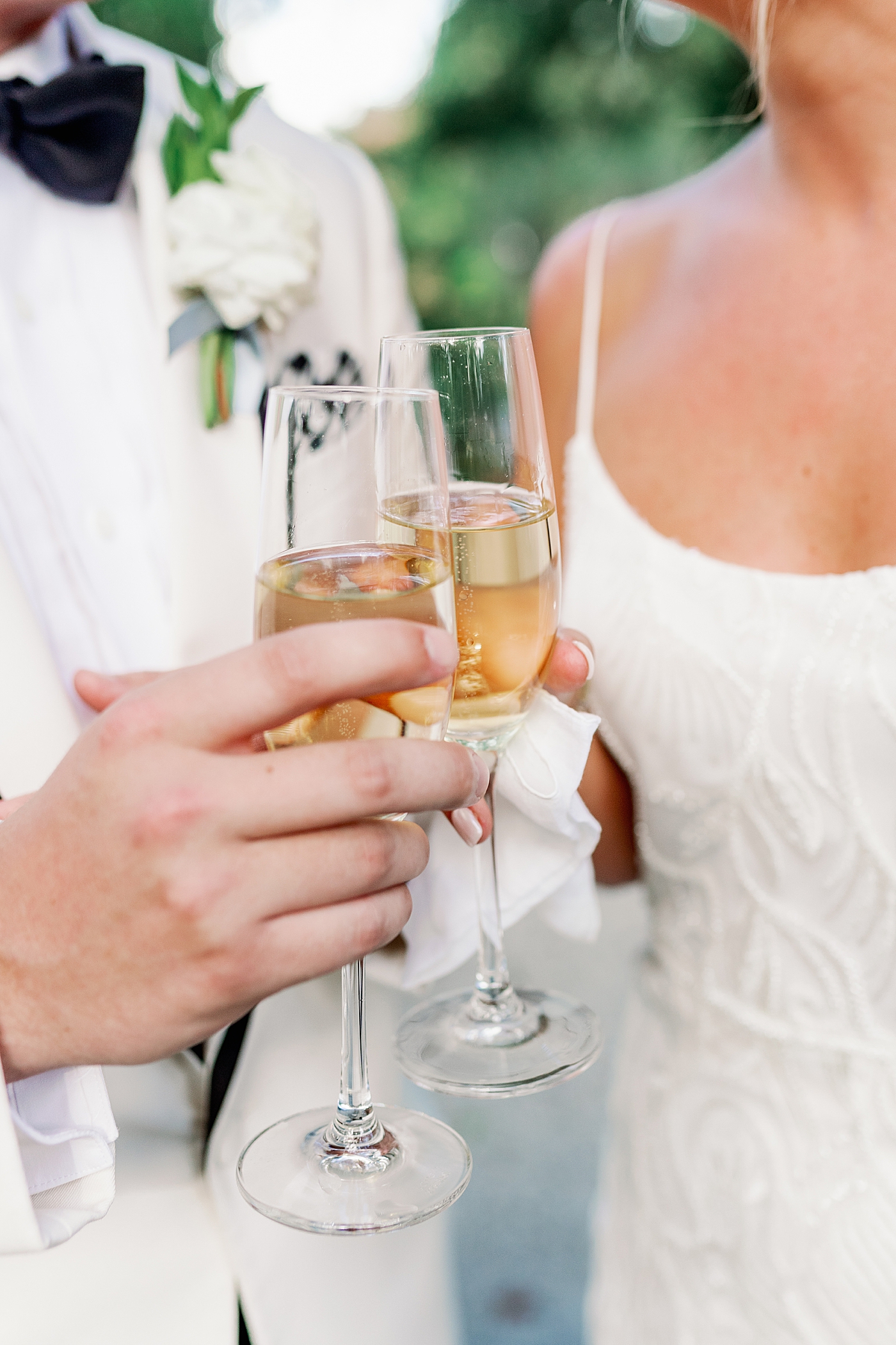 Bride and groom toasting champagne during their Elegant Grandmillenial Charleston Wedding | Images by Annie Laura Photography