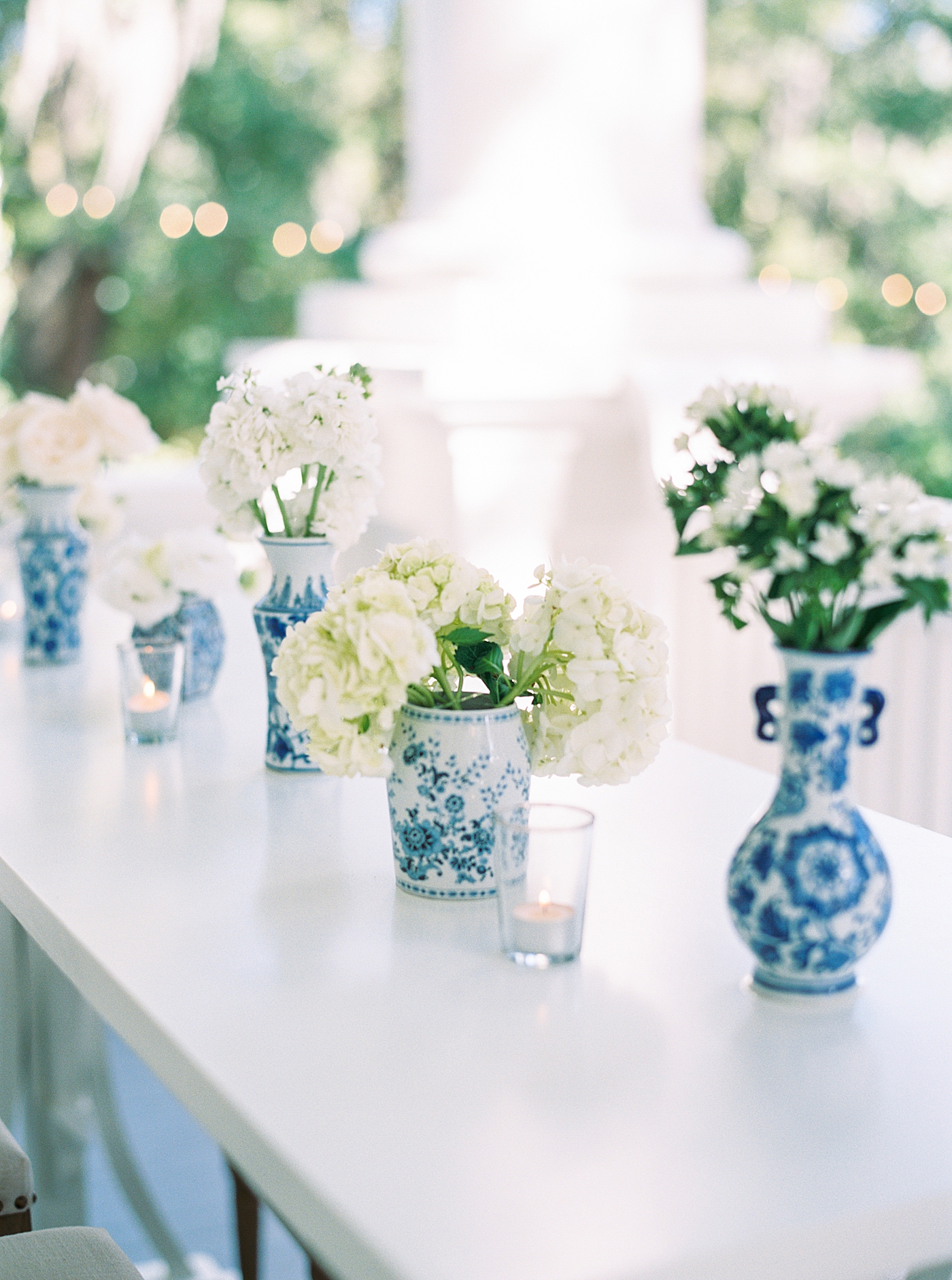 Table details with votives during their Elegant Grandmillenial Charleston Wedding | Images by Annie Laura Photography