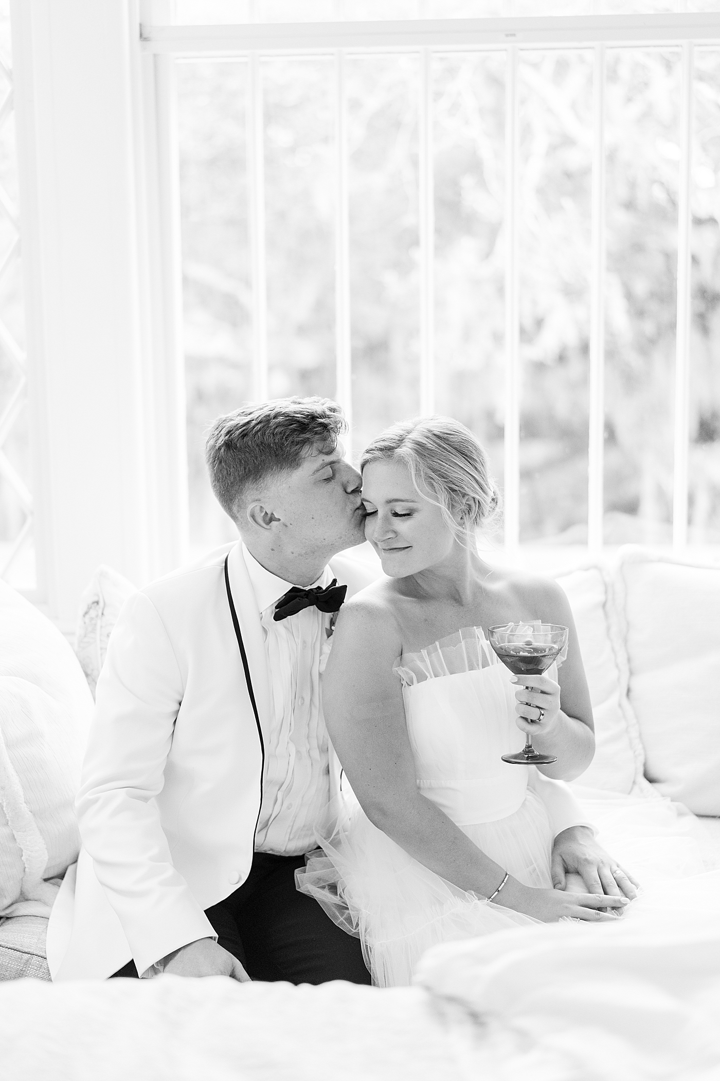 Bride and groom kissing during their Elegant Grandmillenial Charleston Wedding | Images by Annie Laura Photography