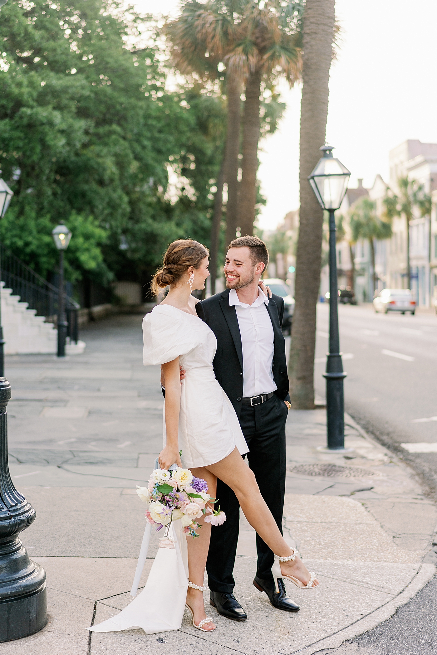 Bride and groom at crosswalk during Elevated City Hall Elopement | Images by Annie Laura Photo