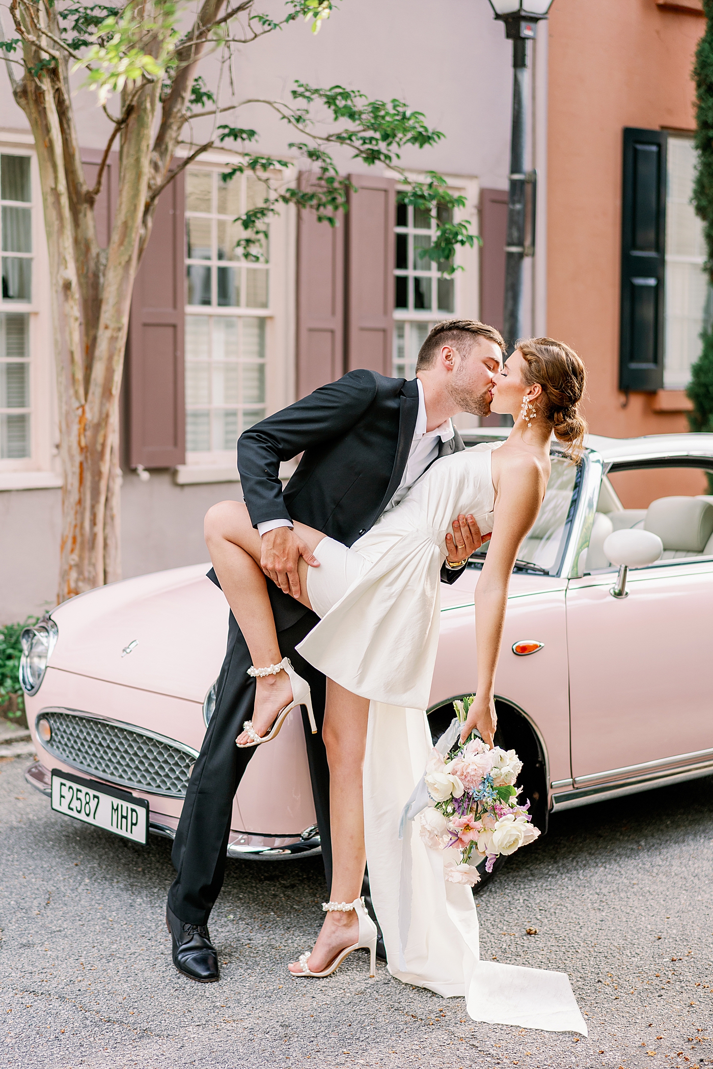 Groom kissing and dipping bride during Elevated City Hall Elopement in Charleston | Images by Annie Laura Photo