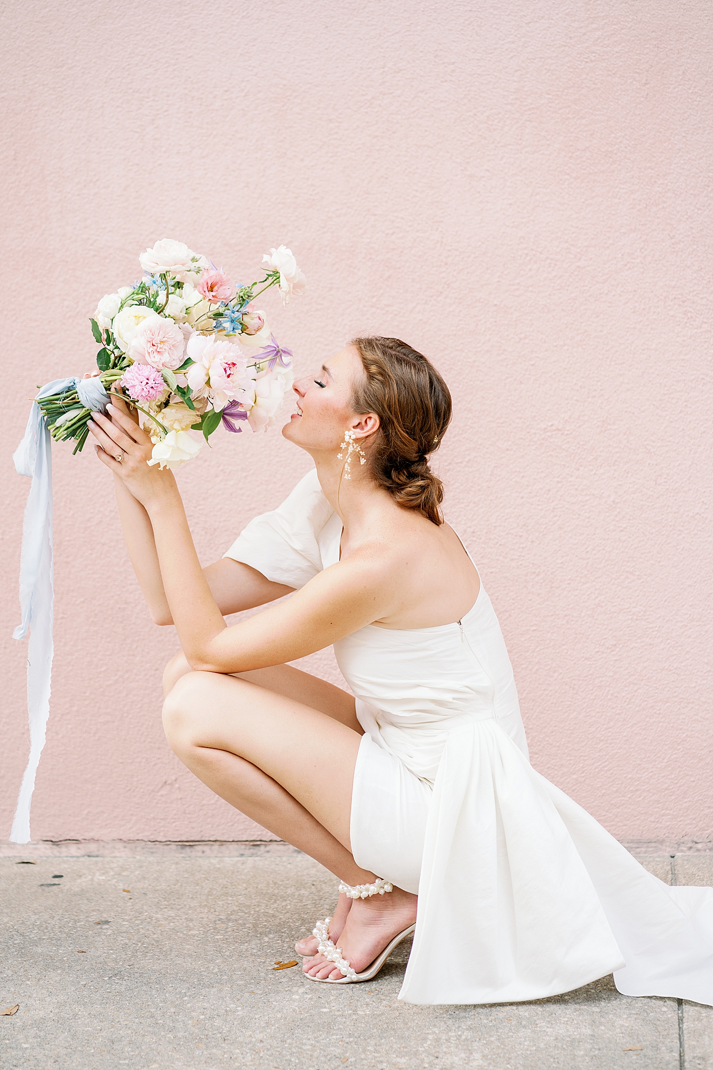 Bride in heels holding a bouquet of flowers| Images by Annie Laura Photo