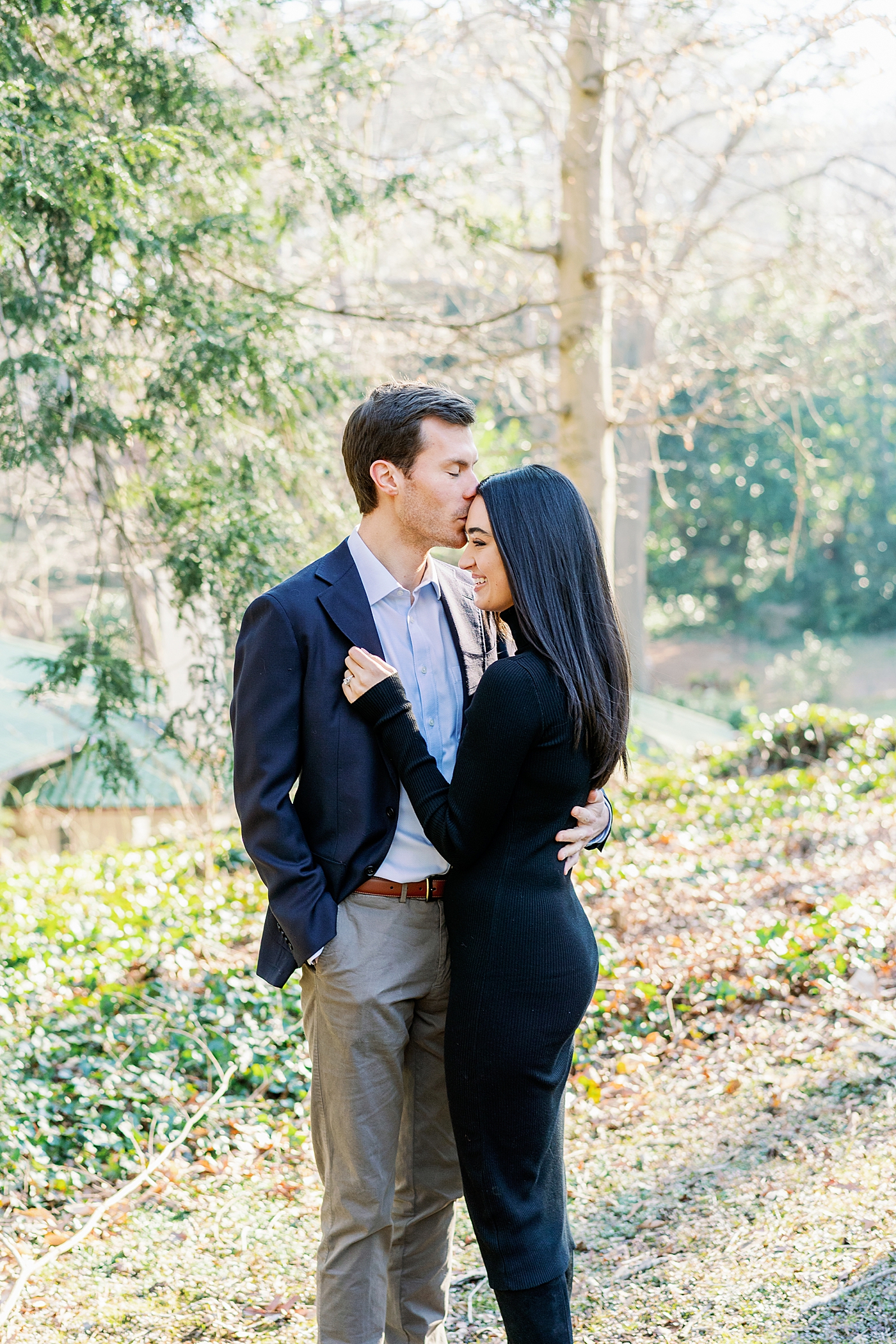 Engaged couple embracing during their Atlanta, GA Garden Engagement | Image by Annie Laura Photo