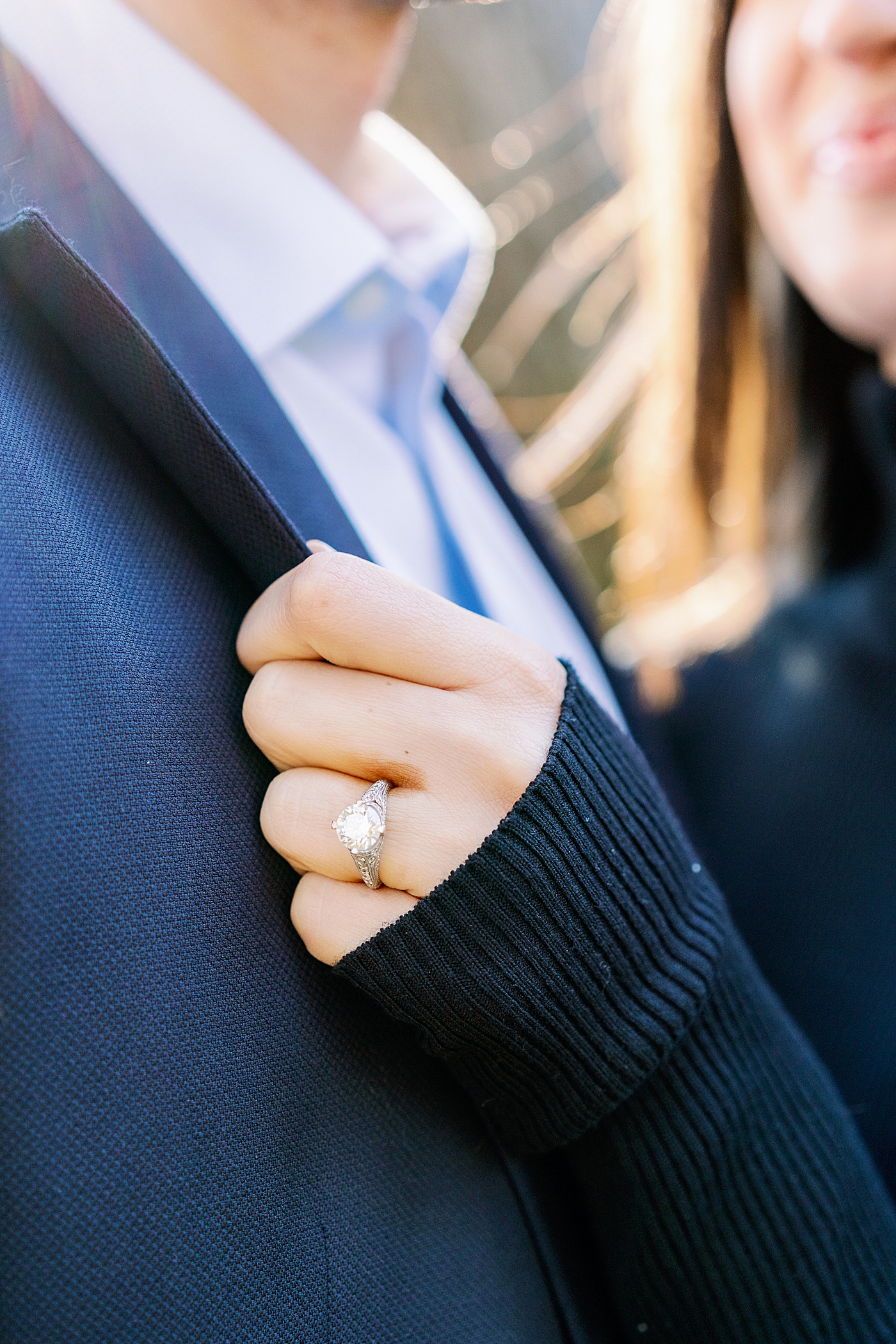 Detail of bride to be's ring on her hand holding groom's lapel | Image by Annie Laura Photo