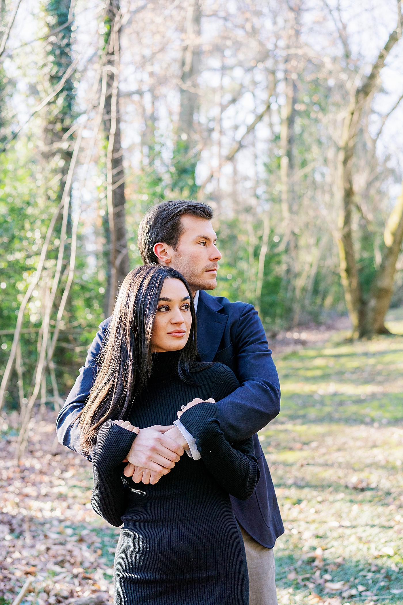 Couple embracing during their engagement session | Image by Annie Laura Photo