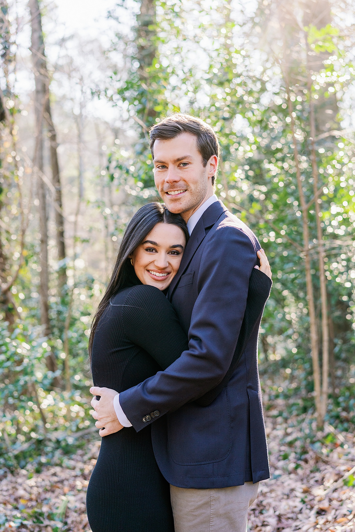 Couple hugging during their engagement session | Image by Annie Laura Photo
