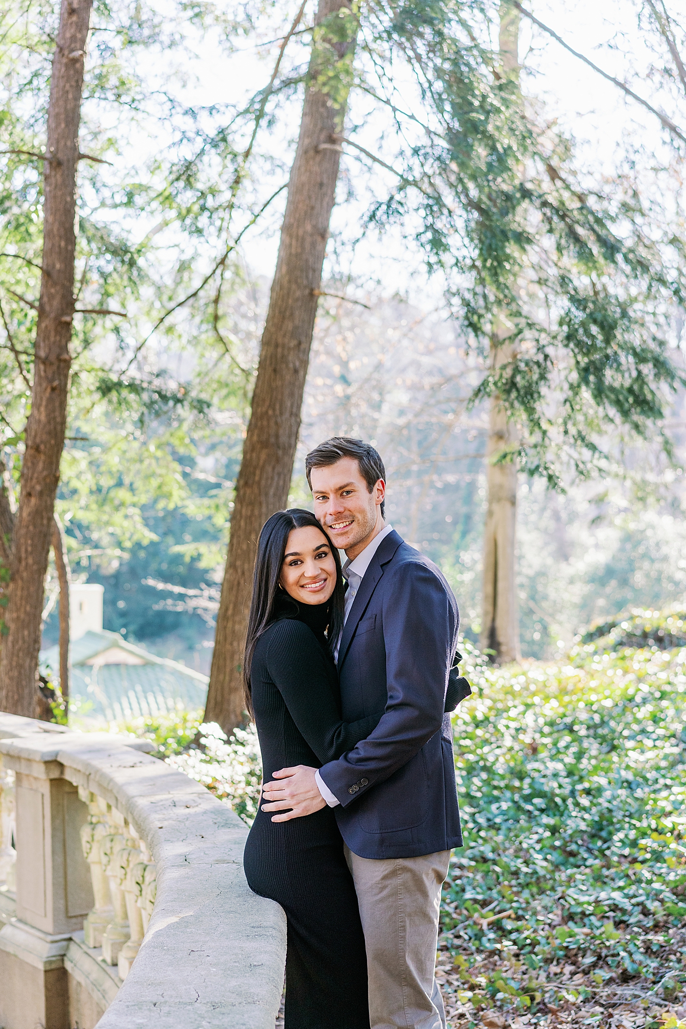 Couple hugging and smiling during their Atlanta, GA Garden Engagement | Image by Annie Laura Photo