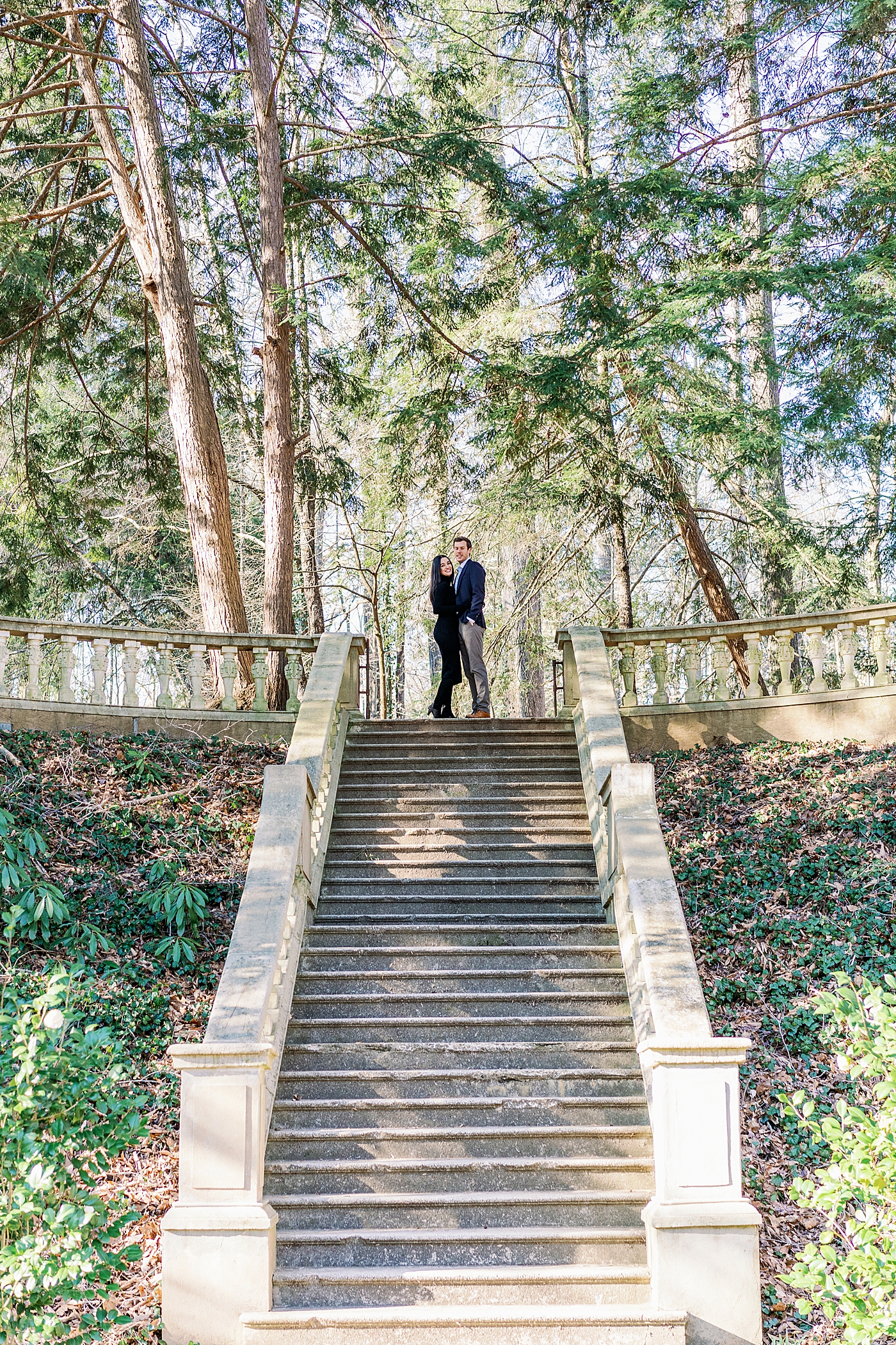 Couple in blue and black at the top of stone staircase | Image by Annie Laura Photo