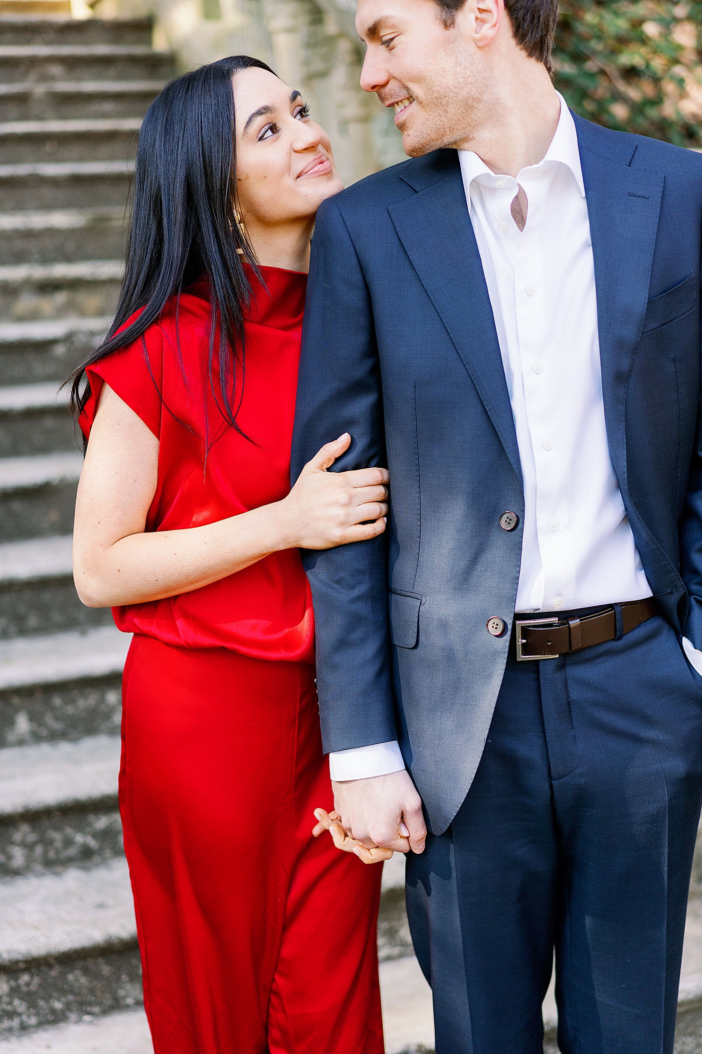 Couple in red and blue holding hands at the park | Image by Annie Laura Photo