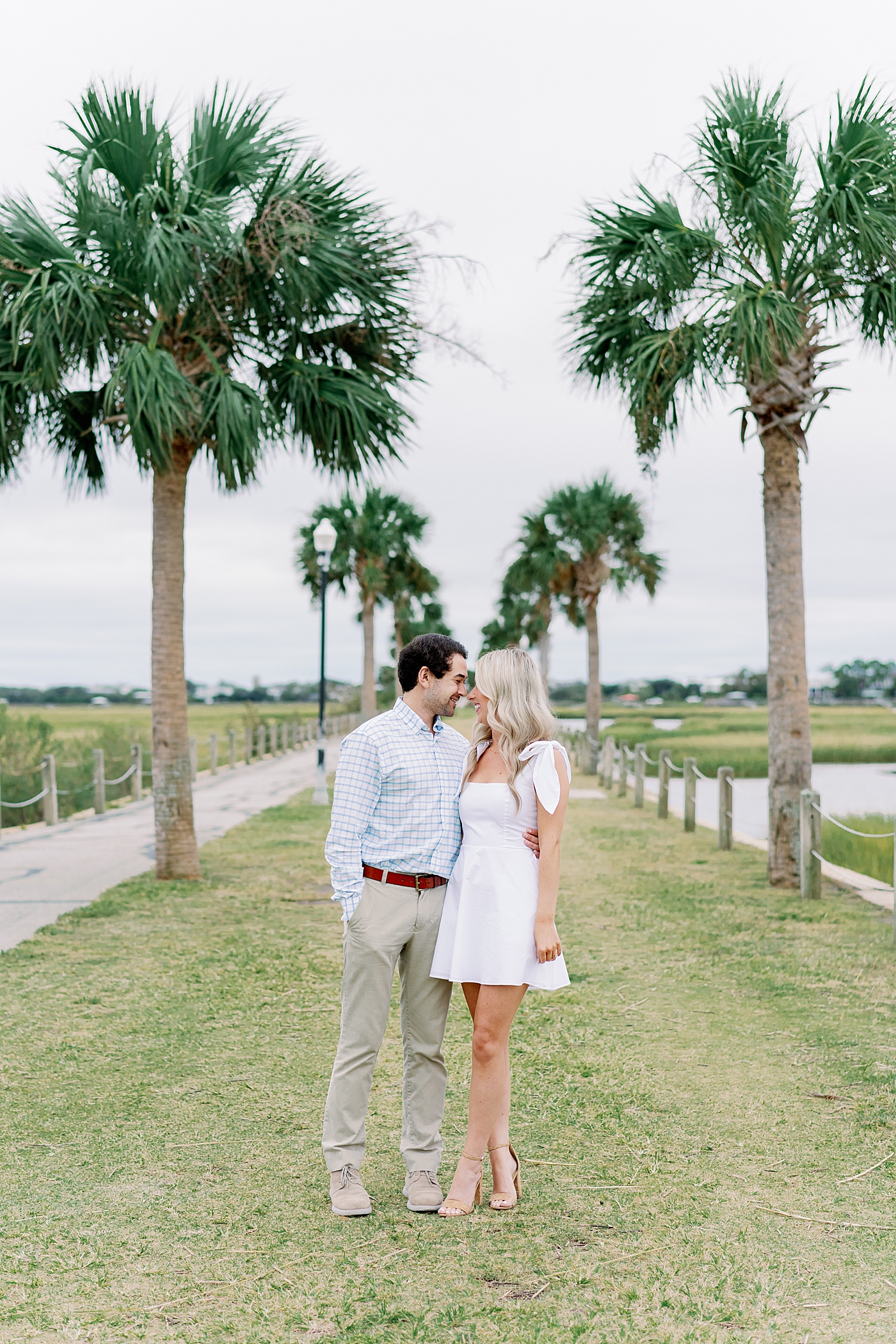 Couple together on the Pitt St Bridge | Intimate Charleston Engagement Session with Annie Laura Photo