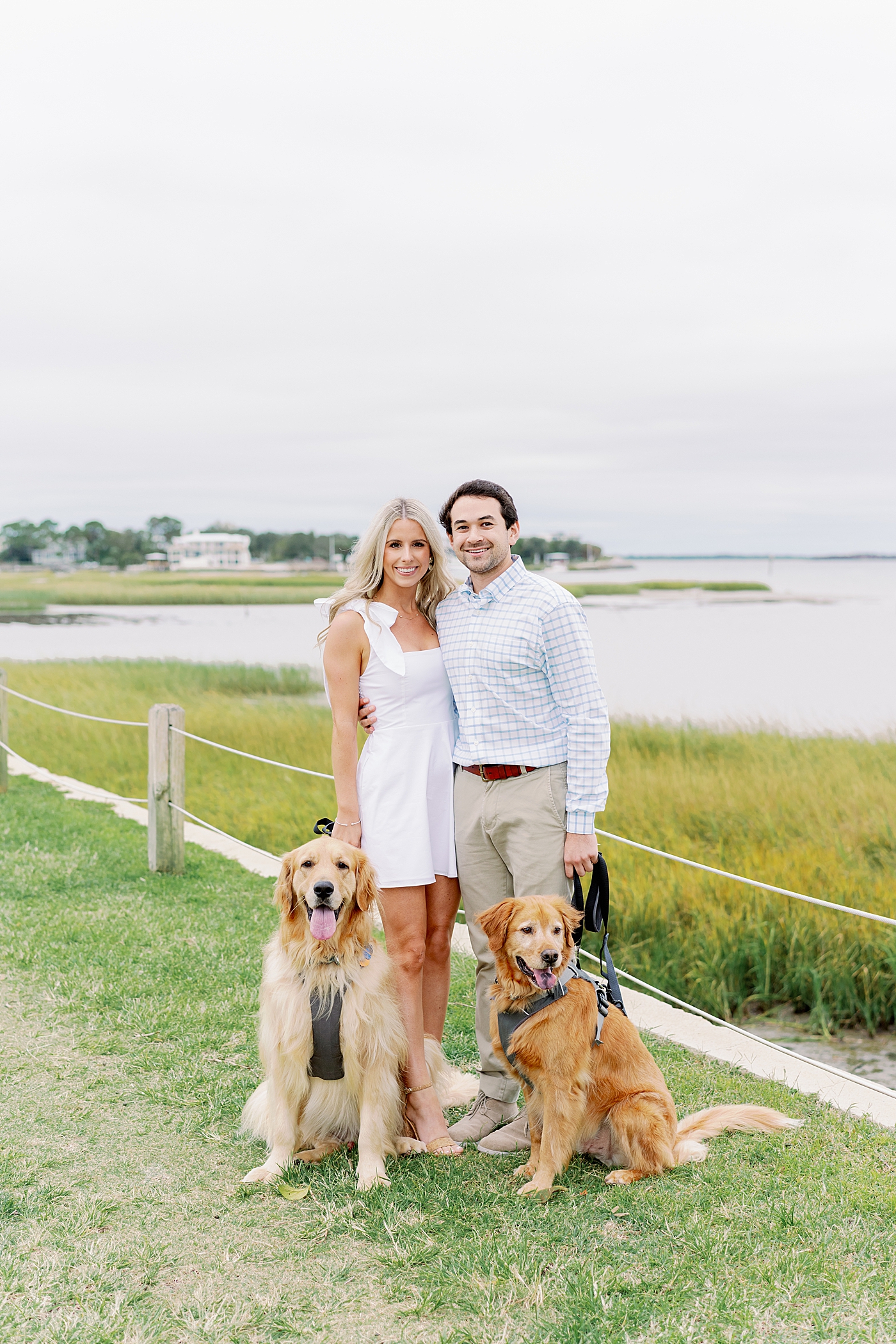 Couple posing together with their two dogs | Intimate Charleston Engagement Session with Annie Laura Photo