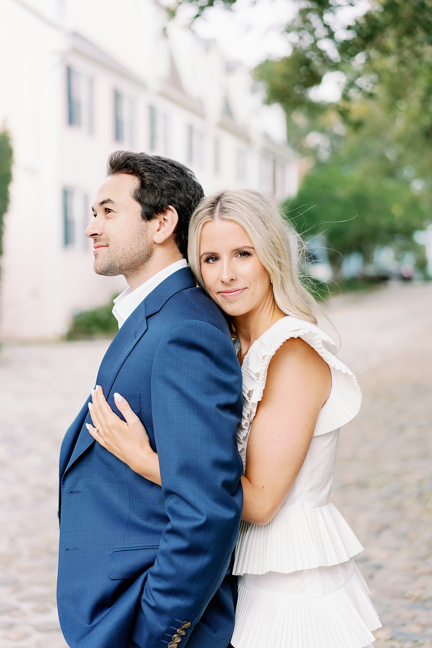 Couple embracing on cobblestone street | Image by Annie Laura Photo