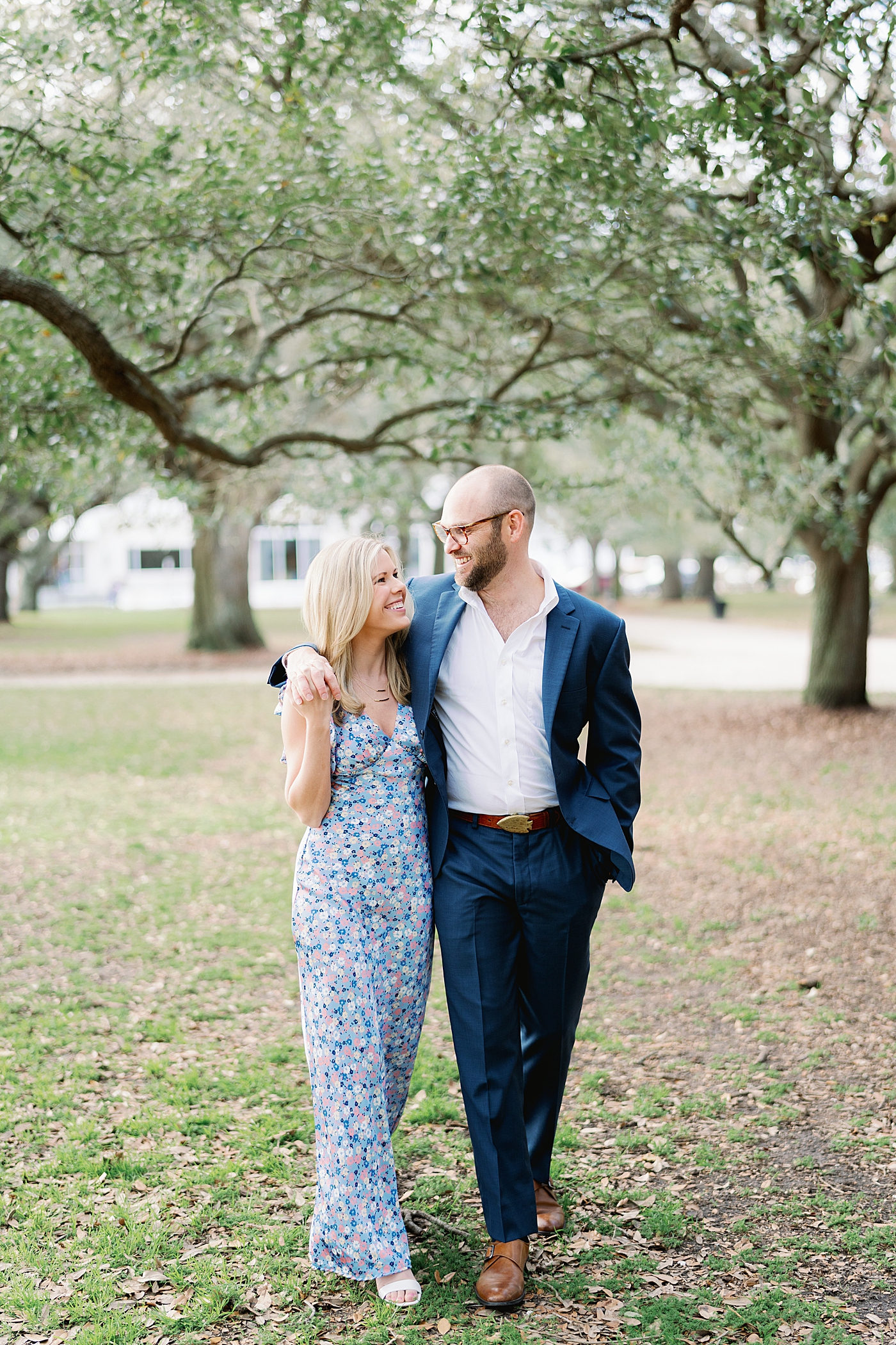 Couple walking while embracing in downtown Charleston | Image by Annie Laura Photo